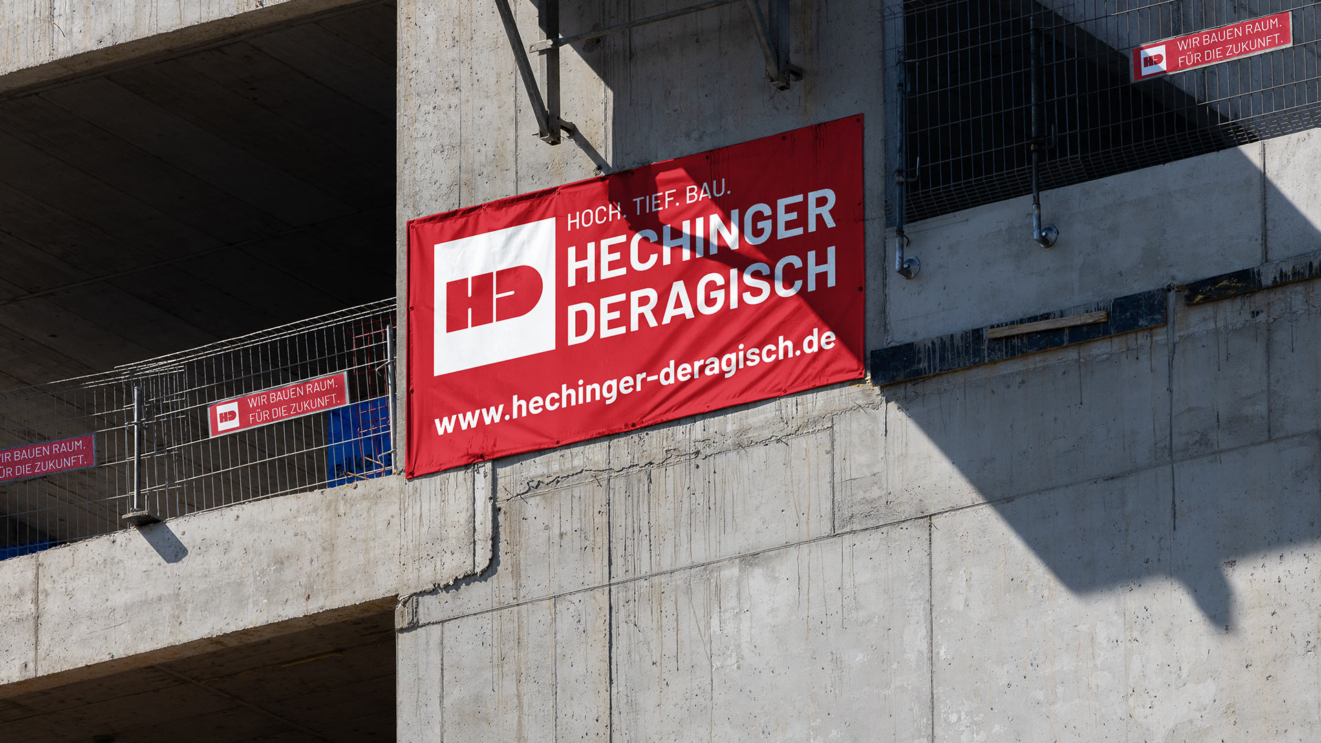 Large banners from Hechinger & Deragisch on a construction site